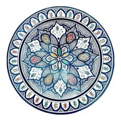 a blue and white plate with an intricate design on the front, in different colors