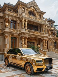 a gold rolls royce parked in front of a large building with elaborately decorated balconies