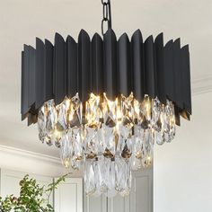 a chandelier hanging from the ceiling in a room