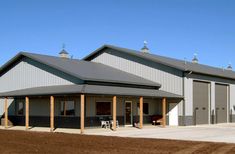 a large building with two garages on each side