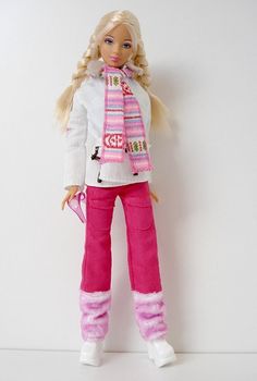 a barbie doll with blonde hair wearing pink pants and a white jacket holding a pink purse