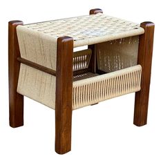 a wooden chair with two woven baskets on it's back legs and seat cushion