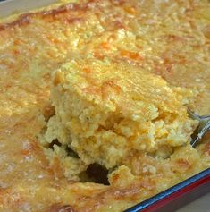 a casserole dish with a spoon in it