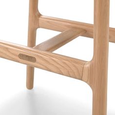 a close up of a wooden stool on a white background with no people around it