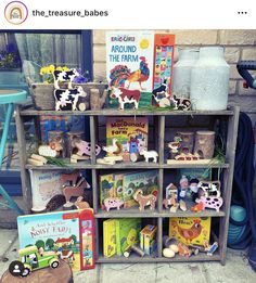 there are many books and toys on this shelf