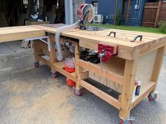 a workbench with tools on it in front of a garage