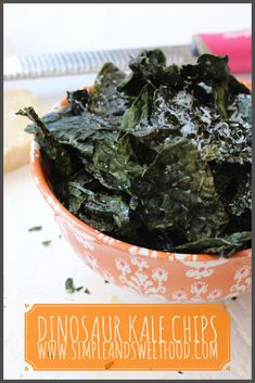 a bowl filled with greens on top of a table