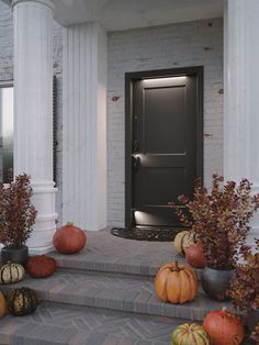 pumpkins and gourds are sitting on the steps in front of a door