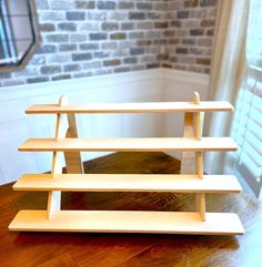 a wooden shelf sitting on top of a table