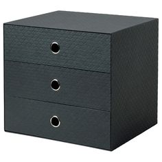 the three drawers are black and have two holes on each drawer, one is empty