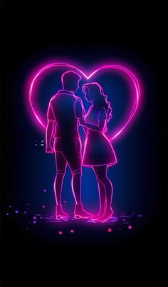 two people standing in front of a neon heart