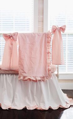 pink ruffled baby bedding with matching bows