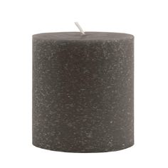 a black pillar with a white candle on top