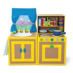 a play kitchen with yellow cabinets and blue curtains on the top shelf is an oven, sink, and bookshelf