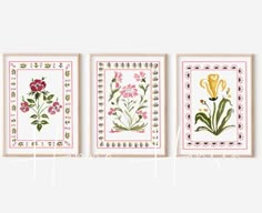 three framed paintings with flowers on them in pink and green colors, one is yellow