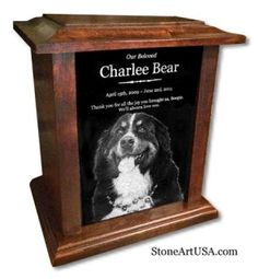 a wooden frame with a dog's photo on it and the words, our beloved charlie bear