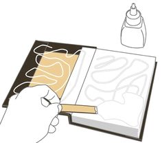 a hand is holding an open book next to a drawing pen and ink bottle on a white background