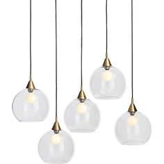 four clear glass globe lights hanging from a ceiling fixture with gold metal fittings and white bulbs