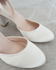 An all-time classic and elegant style with simplicity of satin heels and removable ankle strap.DETAILS:HEEL HEIGHT: 3 inchesCOLORS AVAILABLE: Champagne, White, Ivory, Navy, Burgundy, and Light BlueUPPER: Synthetic upper and liningMATERIALS: Mandmade outsoleSTYLE NAME: SARAH Low Heel Satin Wedding Heels, Satin Low Heel Wedding Heels, Satin Wedding Shoes With 4-inch Heel, Elegant 4-inch Heels For Bridesmaids, Elegant Satin Heels For Wedding Guests, Elegant Low Heel Bridesmaid Heels, Elegant Ankle Strap Wedding Shoes For Bridesmaids, Satin Closed-toe Wedding Shoes, Elegant Satin Wedding Shoes