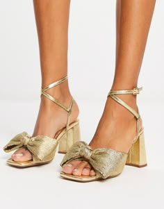 ASOS DESIGN Hitched bow detail mid heeled sandals in gold | ASOS Gold Bow Heels, Gold Trend, Summer Heels, Bridesmaid Shoes, Bow Heels, Shoe Inspo, Gold Shoes, Gold Sandals, Gold Heels