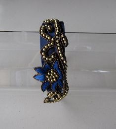 This Royal Blue Gold Beaded Flower Satin Headband is a beautiful accessory for weddings, parties, and other special occasions. It is elegant, unique, ornate, and super chic! A truly exquisite piece that will definitely add a special touch to your outfit!!I only accept PayPal and ship all orders within 24 hours via USPS.Feel free to send me a convo with any questions.Thank you for visiting Hettie Hair Accessories! Elegant Flower Hair Accessories With Handmade Flowers, Elegant Flower-shaped Hair Accessories With Handmade Flowers, Elegant Handmade Flower Hair Accessories, Elegant Adjustable Headpieces For Celebration, Elegant Flower Hair Accessories For Gift, Elegant Flower Headpieces For Gifts, Elegant Embellished Flower Jewelry, Elegant Flower Embellished Jewelry, Blue Crown Headpiece For Party