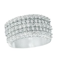 a white gold ring set with round brilliant cut diamonds on the sides and two rows of pave