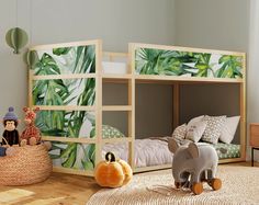 children's bedroom with jungle themed wallpaper and wooden bunkbeds in the corner