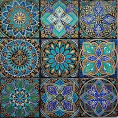 four different designs are shown in blue, green and gold colors on the tile wall