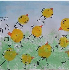 a child's drawing of yellow chickens and grass