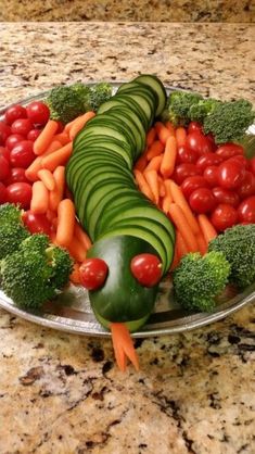 a platter filled with vegetables and fruits