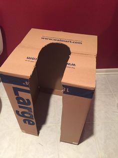 an open cardboard box sitting on the floor