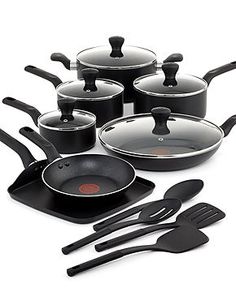 an assortment of black pots and pans