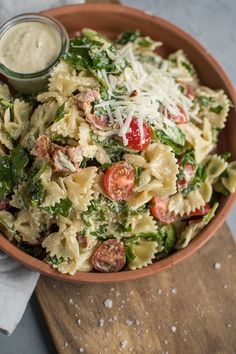 a bowl filled with pasta salad and dressing