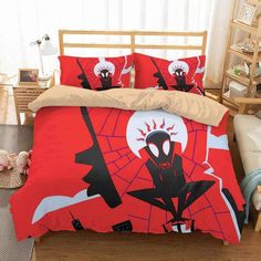 a spiderman bed set with red sheets and pillows