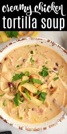 creamy chicken tortilla soup in a white bowl