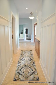 the hallway is clean and ready for guests to walk in or leave their place on