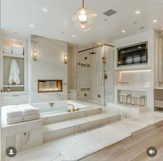 a bathroom with a large bathtub next to a walk in shower