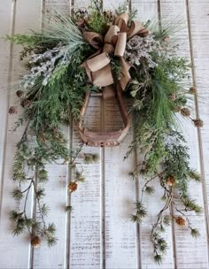 a wooden sled with a wreath on top of it