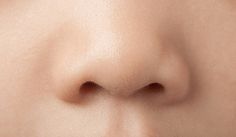 a close up view of the side of a woman's nose