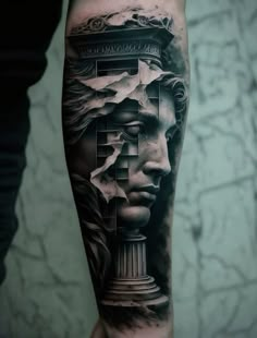 a man's arm with a black and grey tattoo on it, depicting the face of an ancient greek god