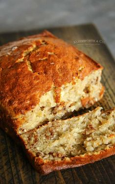 a loaf of banana nut bread on a cutting board