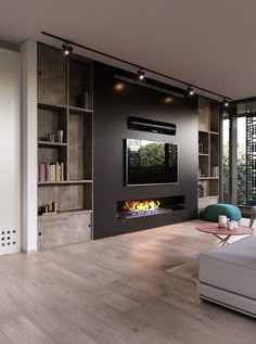 a modern living room with a fireplace and bookcases