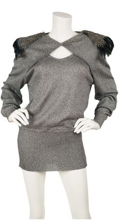 "This 1980s Mila Schön pullover silver lurex sweater features a cut-out neckline and statement shoulder pads with genuine feathers. It was made in Italy of a viscose and polyester blend. It's in very good condition with only a few feathers missing from the top of the left shoulder (please see the last photo).  Measurements: Bust - 40\" Waist - 38.5\" Hips - 23\" (stretch to 37\") Length - 31\" IMPORTANT NOTE FOR CANADIAN SHOPPERS: There is a 15% shipping fee that is automatically applied to Cana Featherstone Vintage, Planet Fashion, Lurex Sweater, Leather Mini Dress, Scarf Top, Scarf Poncho, Vintage Glam, Striped Jacket, Vintage Pants