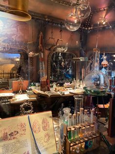 a room filled with lots of different types of glassware and bottles on top of tables