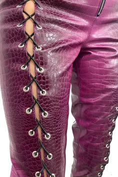 High waisted snake print pants, in embossed faux leather with cutouts along the center front. Featuring corseted lacing with black ties. Fit runs true to size 100% Polyester Lace Up Pants Outfit, Patchwork Leather Pants, Patch Leather Pants With Lace, Lace Up Front Leather Pants, Jess Outfits, Leather Corset Outfit, Snake Clothes, Purple Faux Leather Pants, Snake Fashion