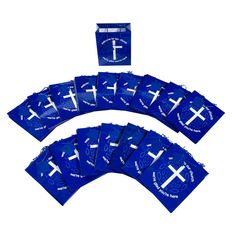 blue bags with white crosses on them are laid out in the shape of a cross