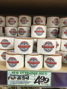 several rows of new trader joe's ice creams on display in a store