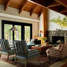 a living room filled with furniture and a fire place