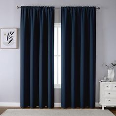 the curtains in this room are dark blue