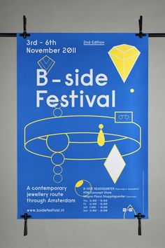 a poster hanging on the side of a building advertising b - side festival, with an image of a diamond